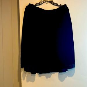 A pretty black velvet skirt , size 8 . In good condition.